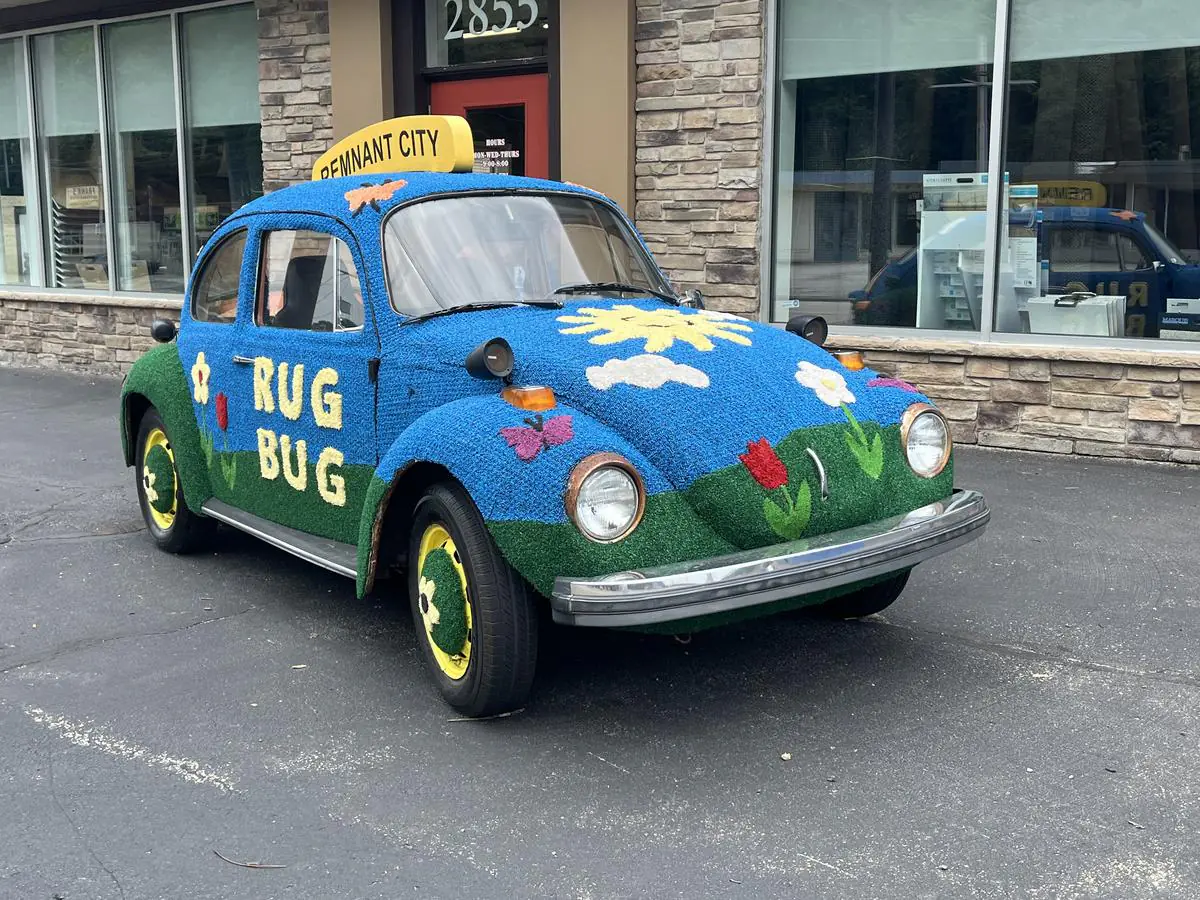 The legendary Rug Bug Volkswagen Beetle parked outside the Remnant City storefront on Saw Mill Run Boulevard