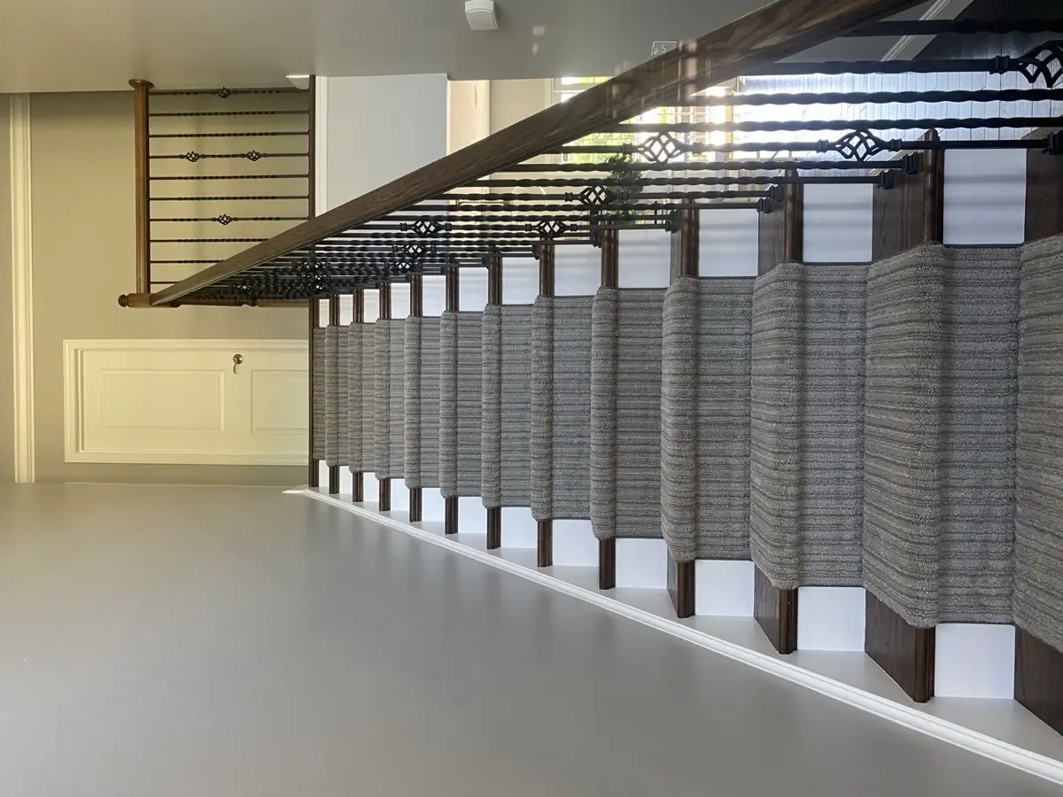 Gray striped runner with iron balusters